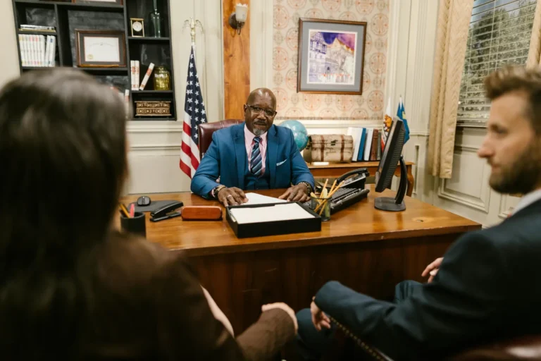 A lawyer hosting a meeting in his office